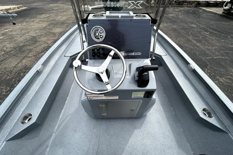 Slide: The Image of 2026 Xpress H20B Bay boat interior with steering wheel and control panel. - 40