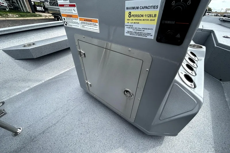 Slide: The Image of 2026 Xpress H20B Bay boat console with storage compartment and capacity label. - 41
