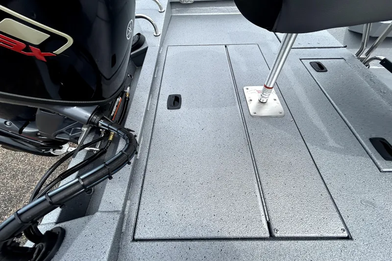 Slide: The Image of 2026 Xpress H20B Bay boat deck with motor and seating details. - 45
