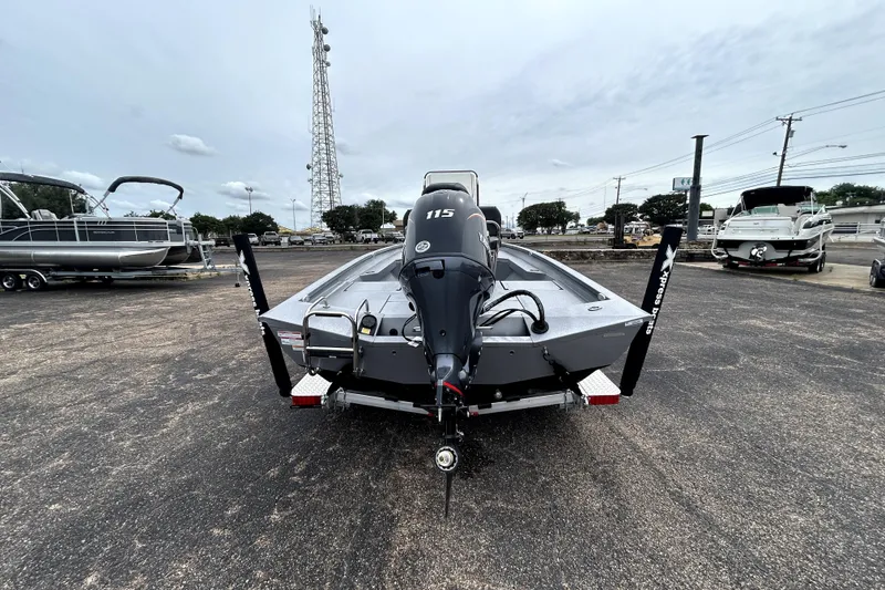 Slide: The Image of 2026 Xpress H20B Bay boat with 115 horsepower engine, parked outdoors. - 8