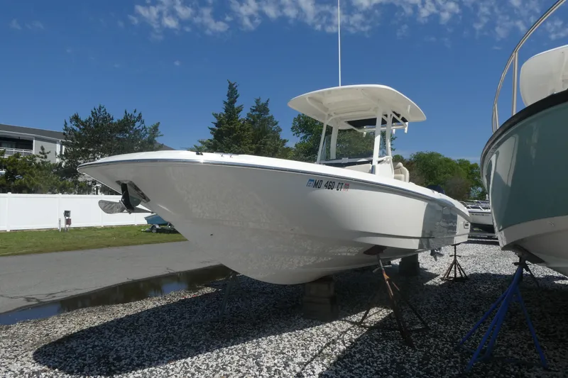 The Image of 2019 Boston Whaler 270 Dauntless boat on display, sunny day, gravel lot. - 0