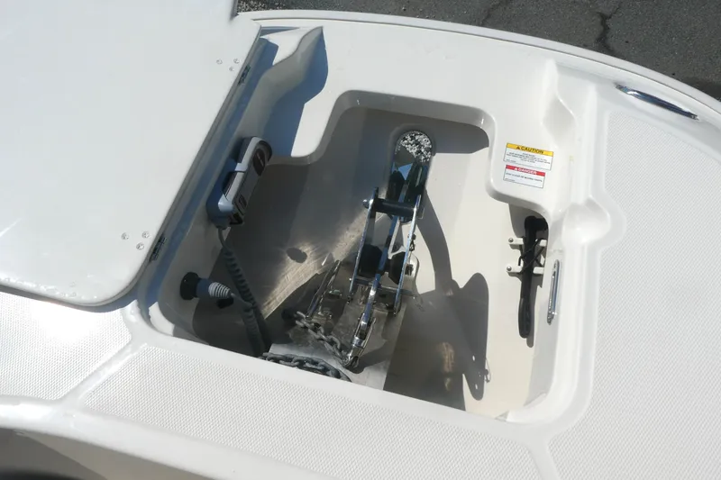 Slide: The Image of Anchor compartment of 2019 Boston Whaler 270 Dauntless boat, featuring storage and equipment. - 11