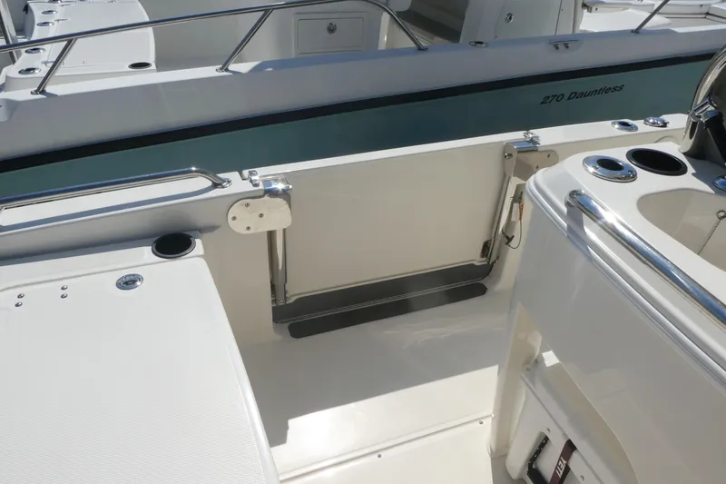 Slide: The Image of 2019 Boston Whaler 270 Dauntless boat interior with sleek design and stainless steel features. - 12