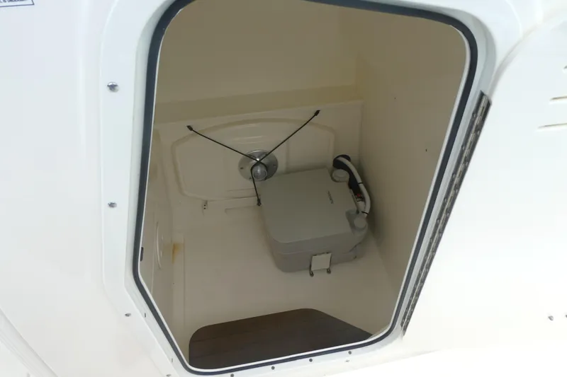 Slide: The Image of 2019 Boston Whaler 270 Dauntless boat storage compartment interior view. - 15