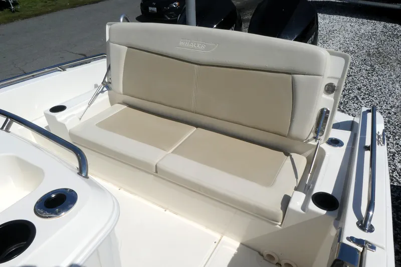 Slide: The Image of 2019 Boston Whaler 270 Dauntless boat seating area with beige cushions. - 3
