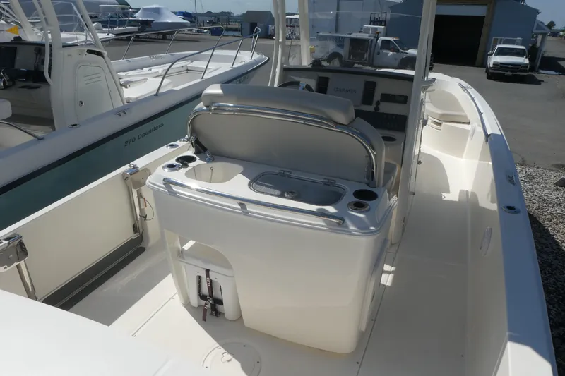 Slide: The Image of 2019 Boston Whaler 270 Dauntless boat interior with helm and seating area. - 4