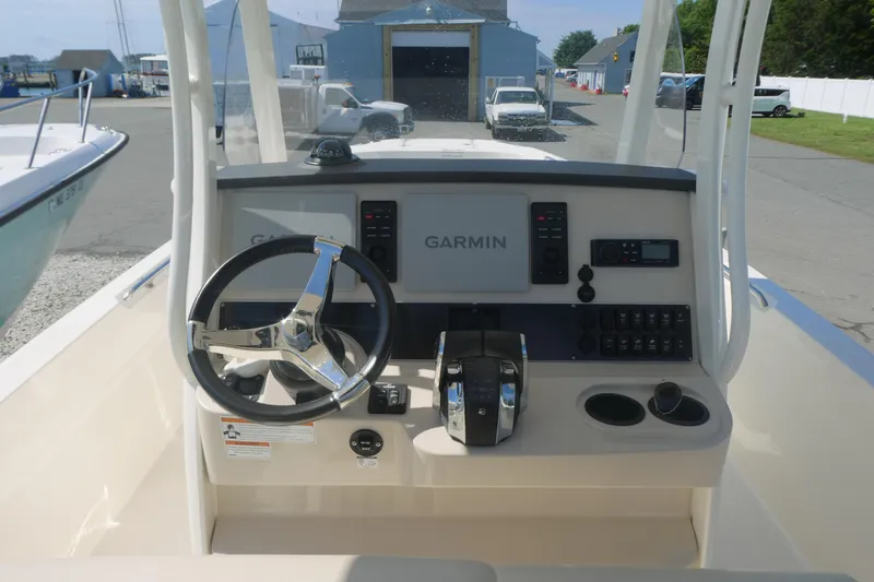 Slide: The Image of 2019 Boston Whaler 270 Dauntless helm with Garmin navigation system and steering wheel. - 6