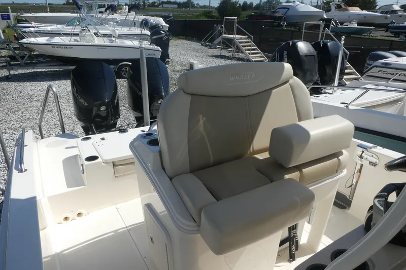 Slide: The Image of 2019 Boston Whaler 270 Dauntless boat interior with dual Mercury engines. - 7