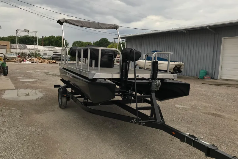 Slide: The Image of 2024 Tigershark 700 12' Mini Pontoon on trailer in outdoor setting. - 14