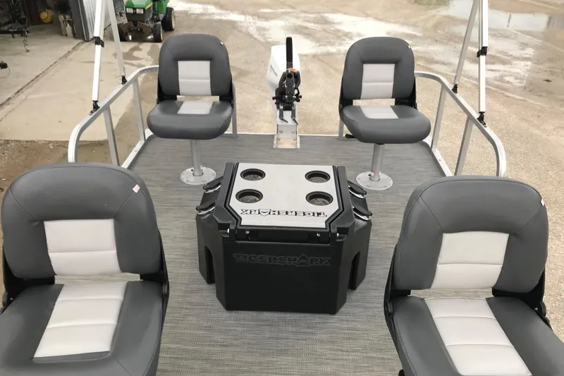 Slide: The Image of 2024 Tigershark 700 12' Mini Pontoon with four seats and central console. - 8
