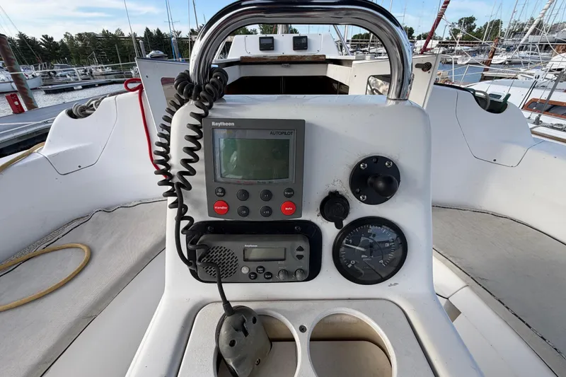 Slide: The Image of Cockpit of 2000 Hunter 310 sailboat with navigation instruments and steering wheel. - 10