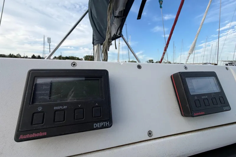 Slide: The Image of Hunter 310 sailboat dashboard with Autohelm depth and speed displays, 2000 model. - 13