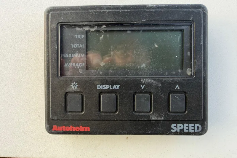 Slide: The Image of Autopilot speed display on a 2000 Hunter 310 sailboat, showing trip and speed options. - 14