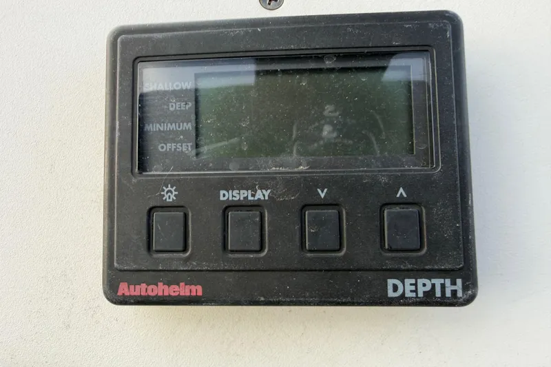 Slide: The Image of Autohlem depth display on a 2000 Hunter 310 sailboat, showing control buttons. - 15