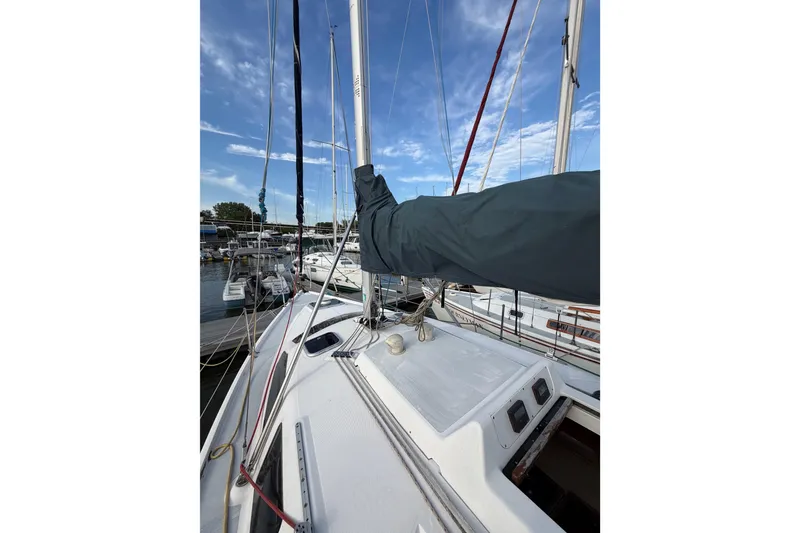 Slide: The Image of Sailboat deck view of a 2000 Hunter 310 at a marina. - 22