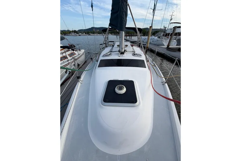 Slide: The Image of 2000 Hunter 310 sailboat docked at marina, view of deck and mast. - 30