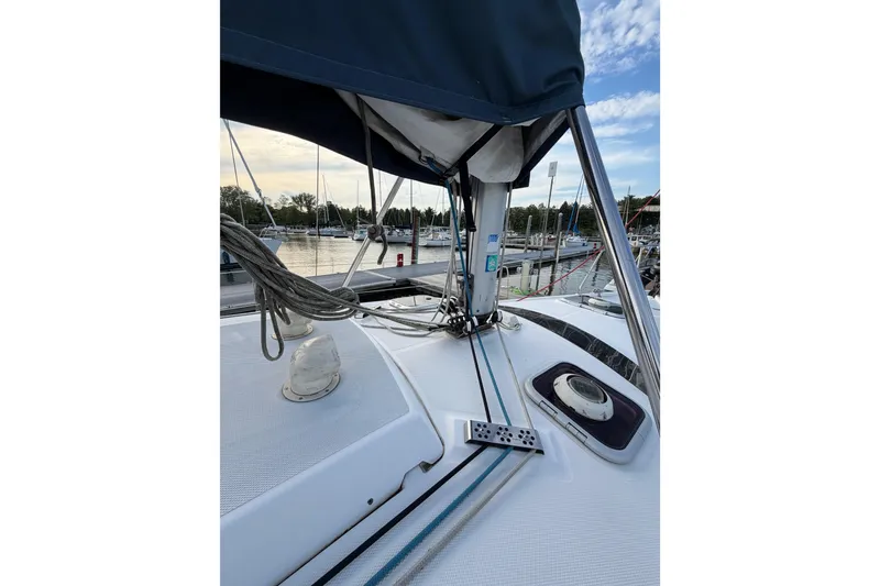 Slide: The Image of Sailboat deck of 2000 Hunter 310, docked at marina with rigging and hatch. - 32