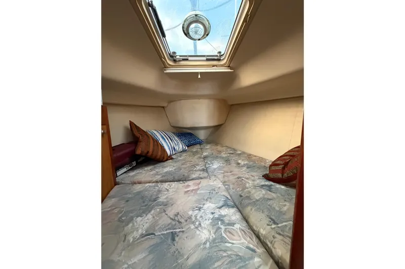 Slide: The Image of Interior cabin of 2000 Hunter 310 sailboat with skylight and cushions. - 52