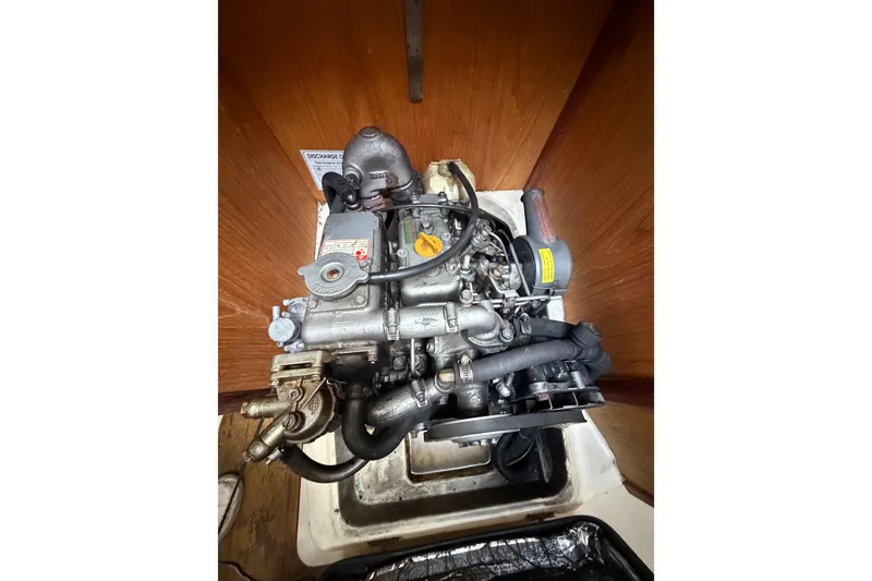 Slide: The Image of Engine of a 2000 Hunter 310 sailboat, showcasing intricate mechanical components. - 66