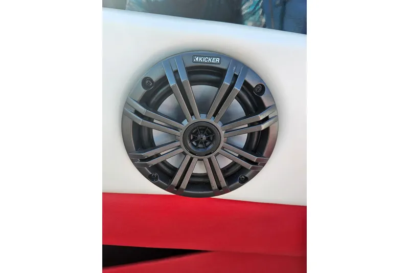 Slide: The Image of Kicker speaker installed in a 2021 Glastron GTS 205 boat interior. - 11
