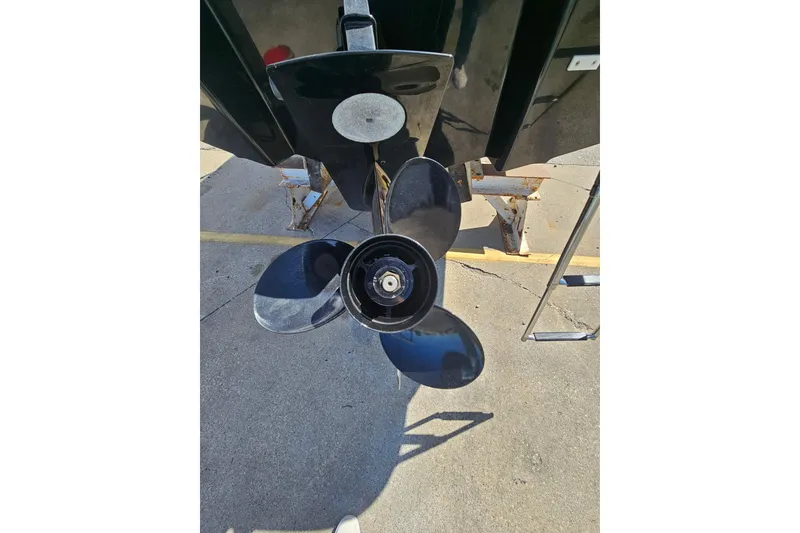 Slide: The Image of 2021 Glastron GTS 205 boat propeller on concrete surface. - 16