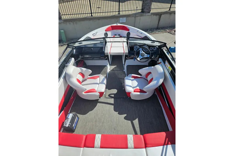 Slide: The Image of 2021 Glastron GTS 205 boat interior with red and white seating. - 6