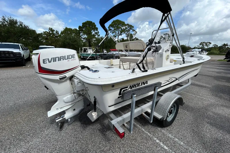 Slide: The Image of 2015 Carolina Skiff JVX18CC boat with Evinrude E-TEC engine on trailer. - 4
