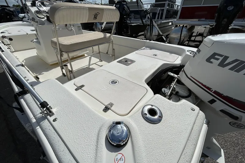 Slide: The Image of 2015 Carolina Skiff JVX18CC boat interior with Evinrude outboard motor. - 8