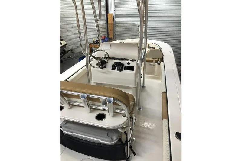 Slide: The Image of 2025 Carolina Skiff 22 Ultra Elite boat interior with steering console and seating. - 15
