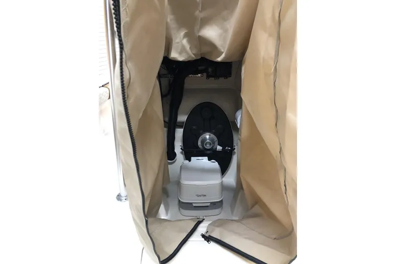 Slide: The Image of 2025 Carolina Skiff 22 Ultra Elite boat interior with covered toilet area. - 5