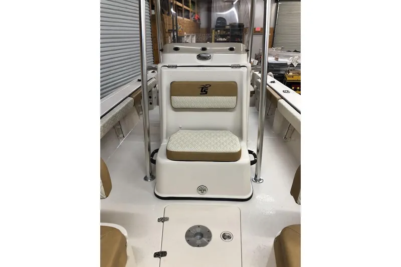 Slide: The Image of 2025 Carolina Skiff 22 Ultra Elite boat interior with cushioned seating and storage. - 6