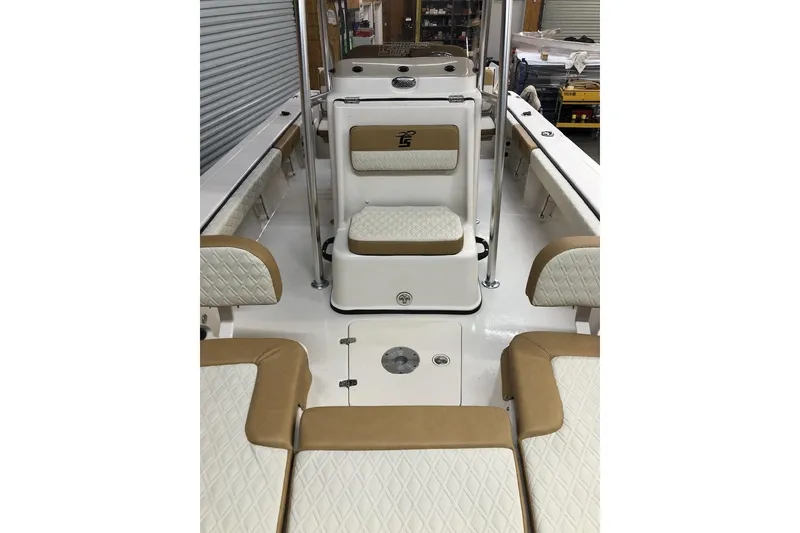 Slide: The Image of 2025 Carolina Skiff 22 Ultra Elite boat interior with tan and white seating. - 7