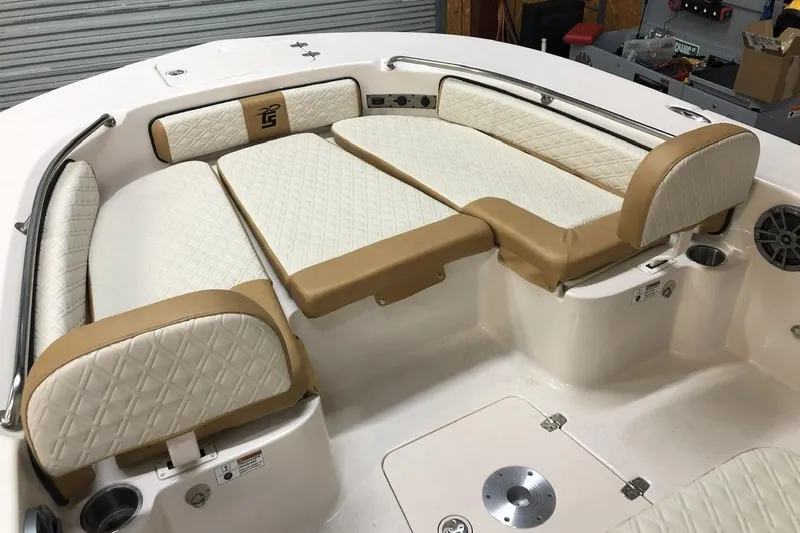 Slide: The Image of 2025 Carolina Skiff 22 Ultra Elite boat interior with cushioned seating and storage. - 8