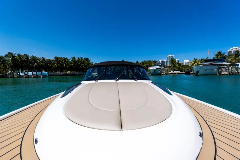 Slide: The Image of Luxurious 2022 Wajer 38 yacht docked in a scenic marina under clear blue skies. - 4