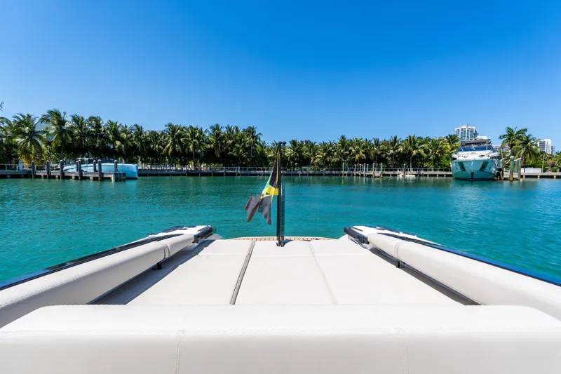 Slide: The Image of Wajer 38 yacht, 2022 model, docked in tropical marina with palm trees and clear blue water. - 6