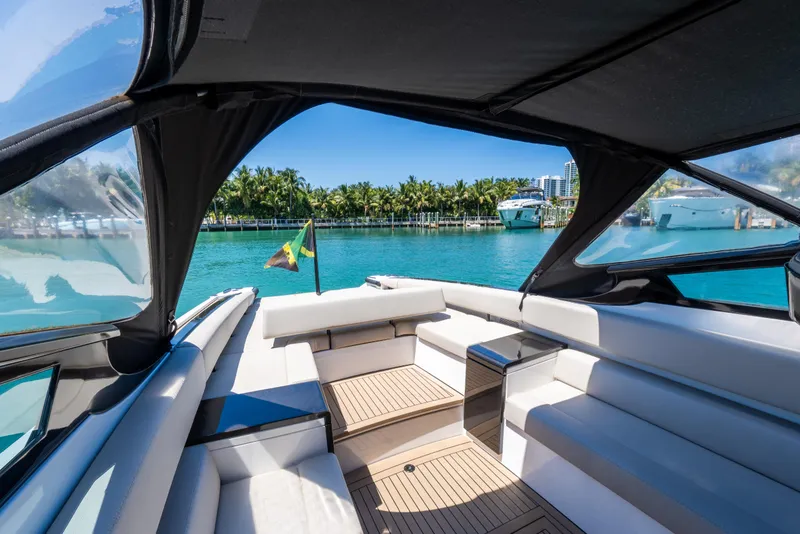Slide: The Image of Luxurious 2022 Wajer 38 yacht interior with waterfront view and tropical backdrop. - 8