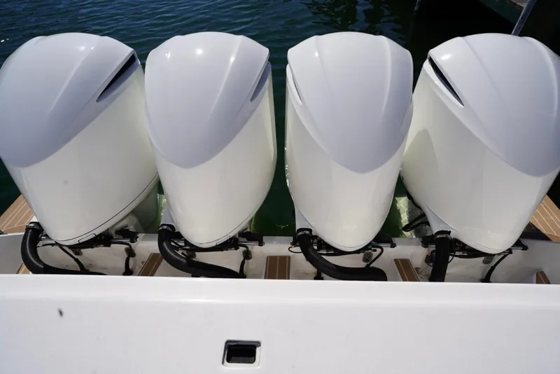 Slide: The Image of Four powerful outboard motors on a 2017 Intrepid 475 Sport Yacht. - 14