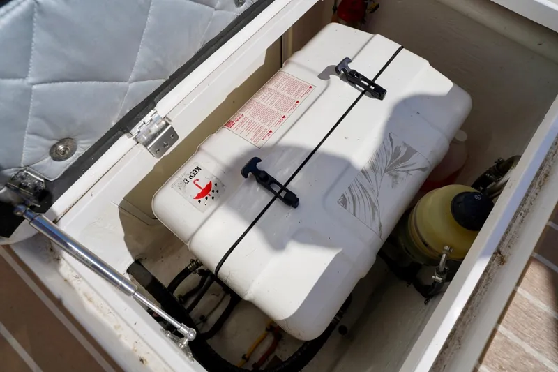 Slide: The Image of Storage compartment of 2017 Intrepid 475 Sport Yacht with safety equipment. - 22