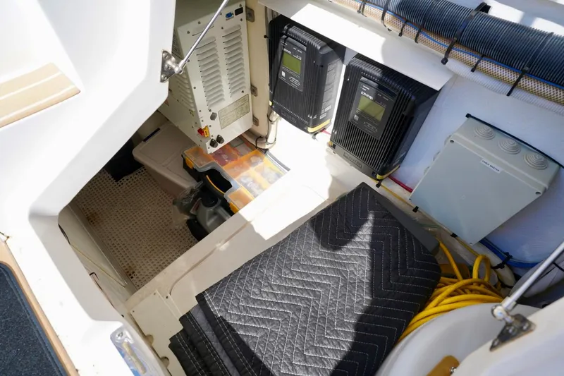 Slide: The Image of Electrical compartment of a 2017 Intrepid 475 Sport Yacht, featuring equipment and wiring. - 25