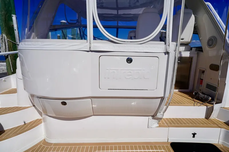 Slide: The Image of 2017 Intrepid 475 Sport Yacht deck with seating and storage compartments. - 26