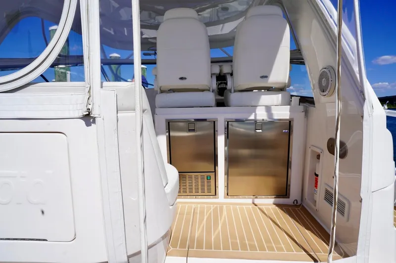 Slide: The Image of 2017 Intrepid 475 Sport Yacht interior with seating and stainless steel storage. - 29