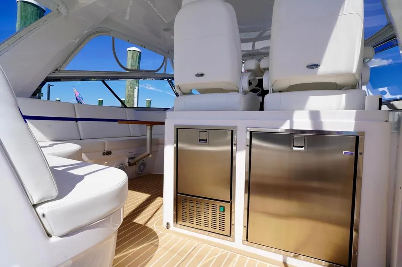 Slide: The Image of Luxurious interior of 2017 Intrepid 475 Sport Yacht with white seating and stainless steel appliances. - 31
