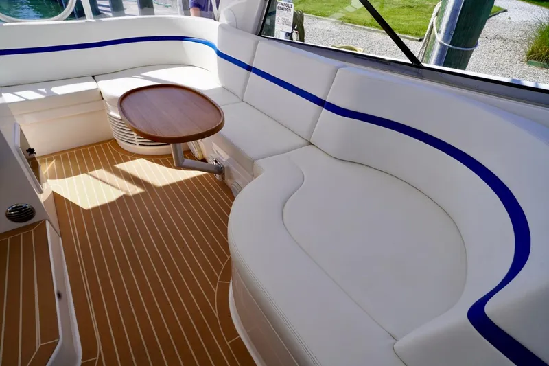Slide: The Image of Luxurious seating area on a 2017 Intrepid 475 Sport Yacht with elegant wood table. - 33