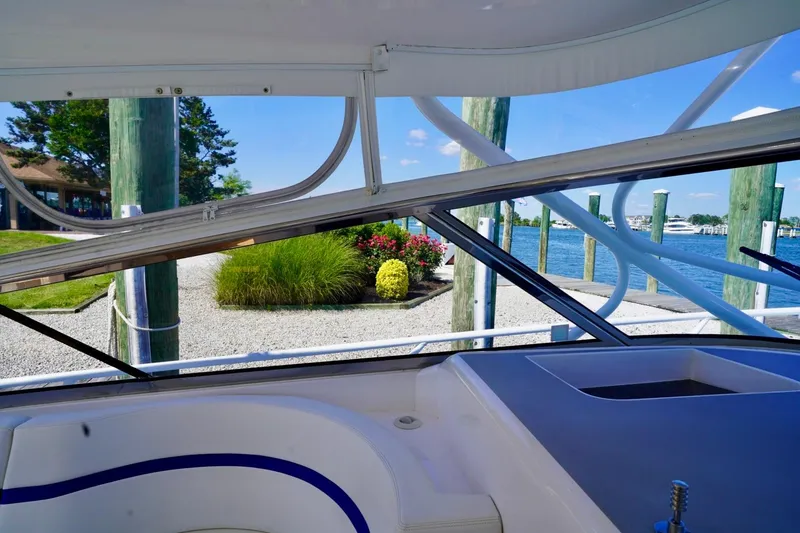Slide: The Image of 2017 Intrepid 475 Sport Yacht interior view at marina with scenic waterfront. - 36
