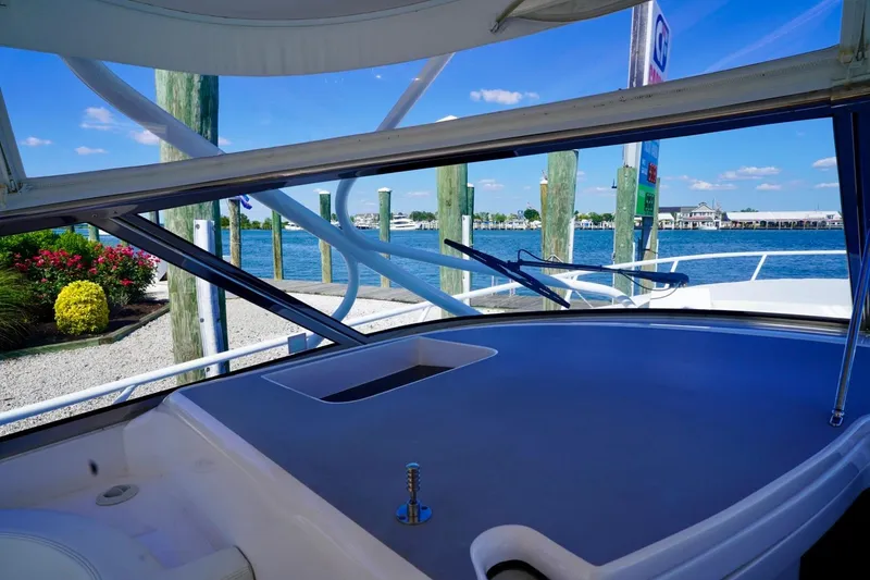 Slide: The Image of 2017 Intrepid 475 Sport Yacht docked, scenic waterfront view. - 37
