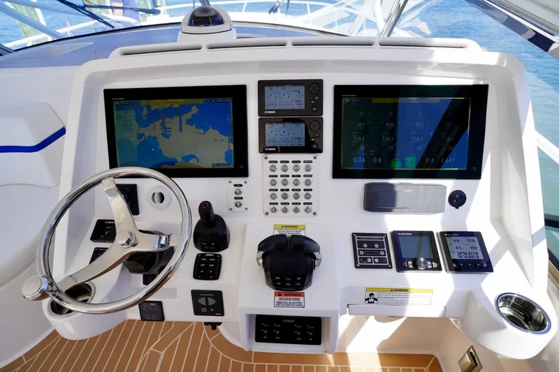 Slide: The Image of Helm of 2017 Intrepid 475 Sport Yacht with navigation screens and controls. - 45