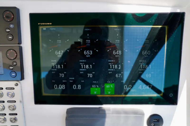 Slide: The Image of Dashboard display of a 2017 Intrepid 475 Sport Yacht showing engine metrics and controls. - 48