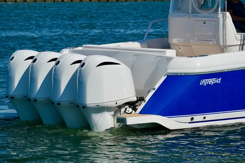 Slide: The Image of 2017 Intrepid 475 Sport Yacht with four powerful outboard engines on blue water. - 5