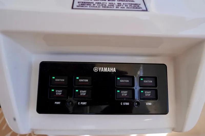 Slide: The Image of Control panel of a 2017 Intrepid 475 Sport Yacht featuring Yamaha ignition and start/stop buttons. - 52