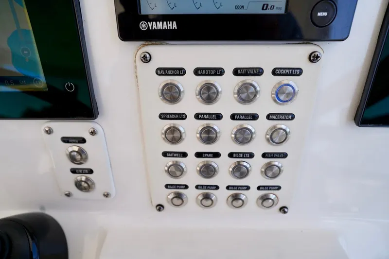 Slide: The Image of Control panel of a 2017 Intrepid 475 Sport Yacht with labeled buttons and Yamaha display. - 53